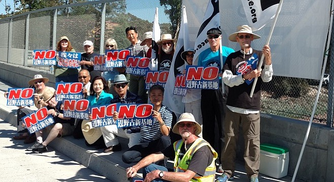 Military protesters including Veterans for Peace's Dave Patterson (front, right) and Japanese Councillor Keiko Itokazu (turquoise blouse, center front)