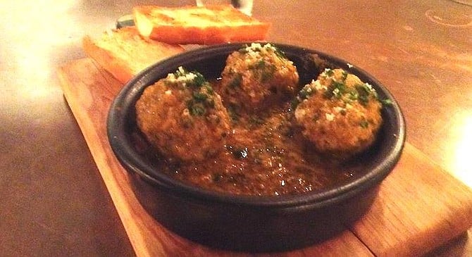 The three meat balls are big, and the soup they're in feels middle-eastern.