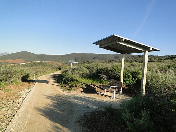Four shade structures are along the trail with benches and space to accommodate wheelchairs.