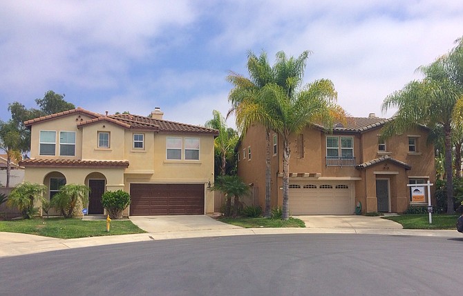 Herbert's home (right) is up for sale.