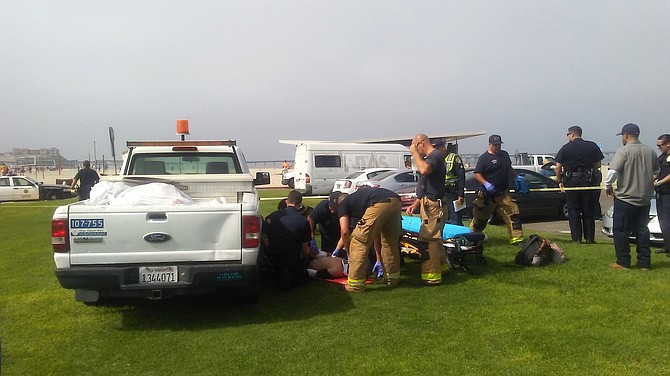 Victim receiving medical attention at the scene of the incident