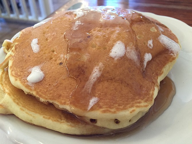 A stack of buttermilk pancakes comes with each omelette. 