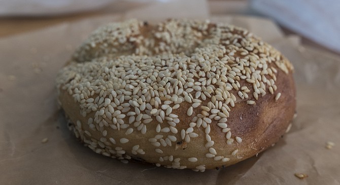 A Montreal-style sesame bagel, wood-fired at the new Nomad Donuts location.