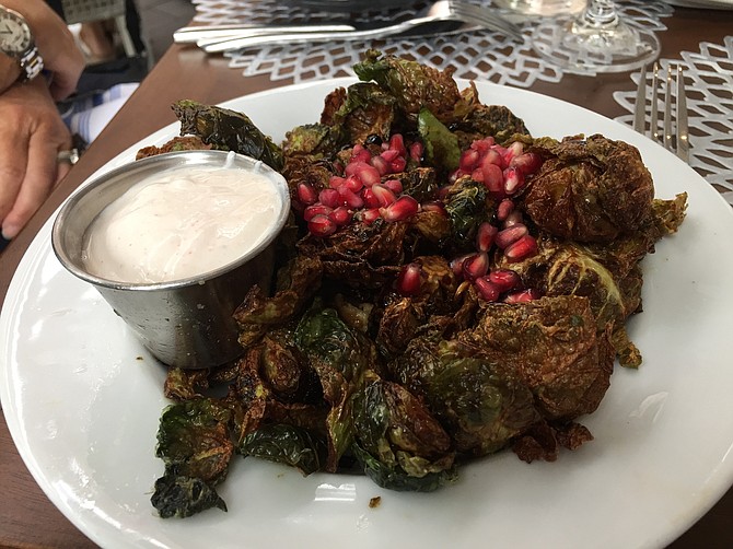 Fried Brussels Sprouts with tart pomegranate seeds and spicy yogurt made for a tasty Mediterranean iteration of the long-trendy app. 
