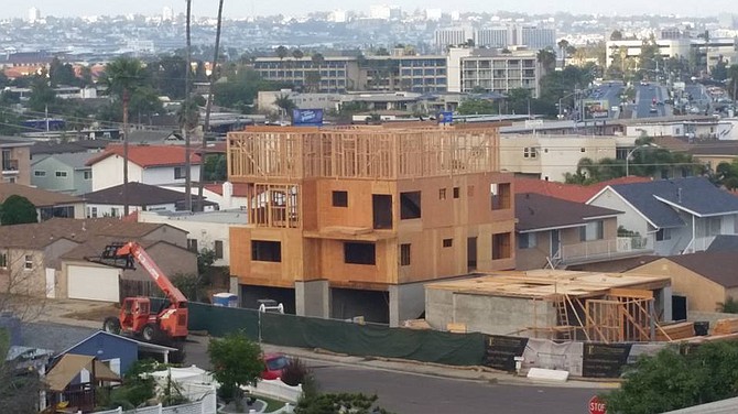 On June 17, 2016, a neighbor woke to find a fourth floor had gone up on the fourplex.