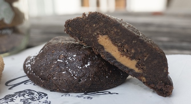 A chocolate cookie stuffed with peanut butter