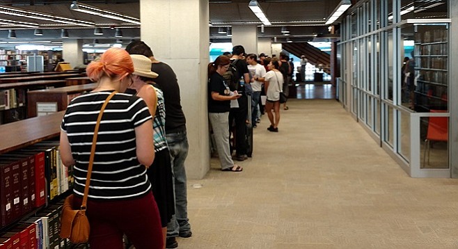 People lined up to get their hepatitis A shot at one of several pop-up clinics hosted by the central library