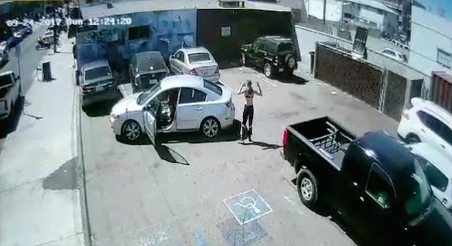 Security camera recorded the driver getting out of her car before she keyed another car.