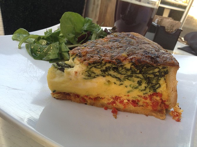 Quiche aux Epinards —  bursting out of the spinach, white, crumbly goat cheese.