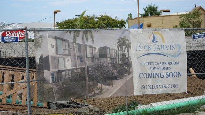 Townhouses are what builders call the rentable units they apply to build. Once built, they magically become condos that need selling. This project on Jarvis and Rosecrans is building apartments but the home loan signage onsite says otherwise. This project's permit states it's a 3-story apartment complex with a subterranean garage. 