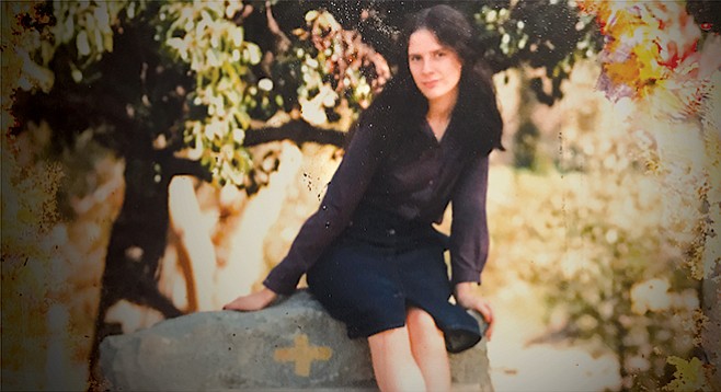 This photo of Persephone L. sitting on a grave stone was found after her death. Through most of her life she indulged a fascination with horror stories and all things Halloween.