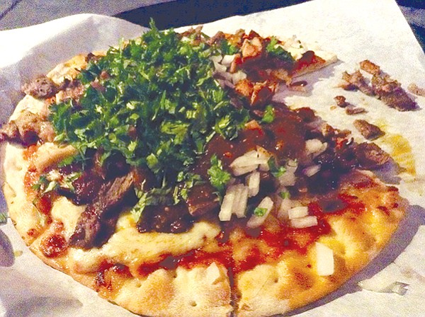 Meat Lovers pizza — packed with carne asada, chicken, and pork al pastor.