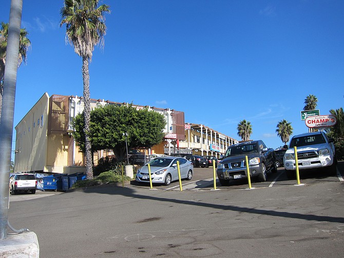 According to tenants, this shopping center will stay next to the new residential development. 