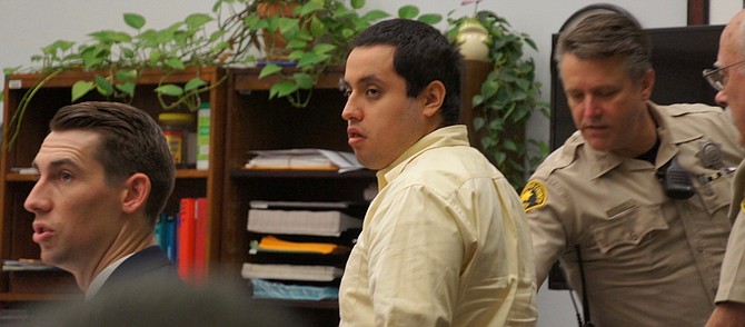 Roberto Flores stood up to curse the jury in his most recent trial. Photo by Eva