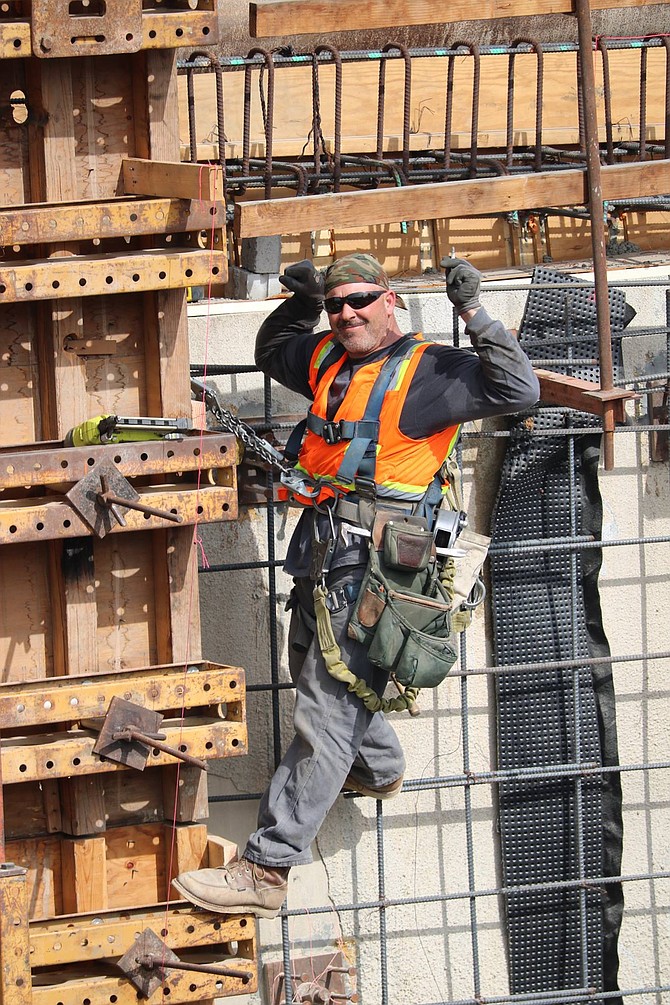 Workers are used to seeing May at the worksite. (photo: Gregory's San Diego)