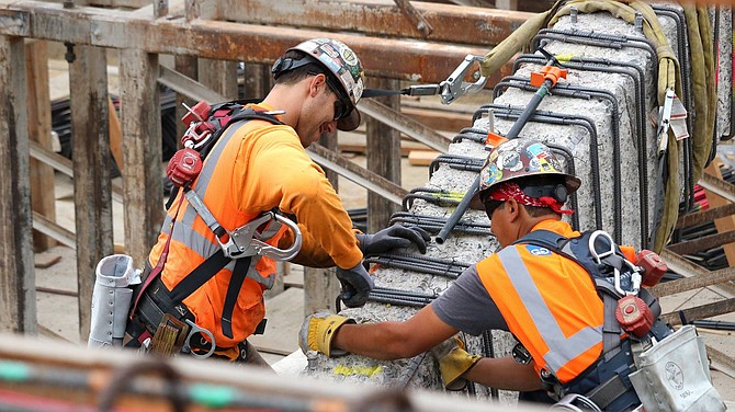 Workers reinforcing the historic three arches. (photo: Gregory's San Diego)