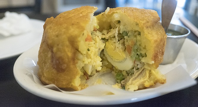 Colombia take on a papa rellena: fried mashed potato ball stuffed with chicken, rice, veggies, and a hard boiled egg.