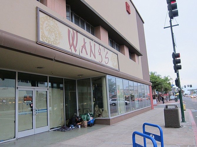 An empty-store front is a magnet for homeless people. 