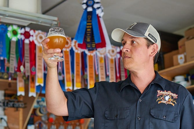 Nick Corona continues to amass award ribbons with his tasty homebrew. Photo by Tim Stahl.