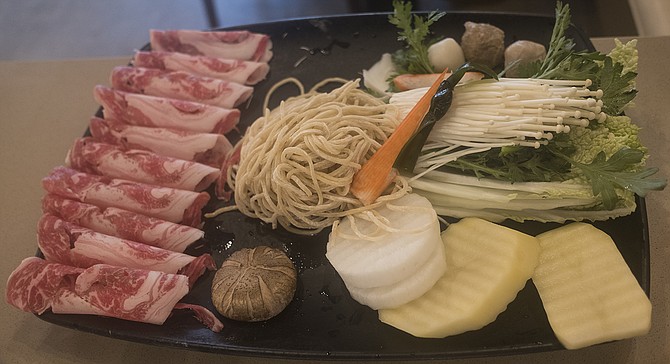 A tray of hot pot add-ins, prior to being tossed into boiling broth.