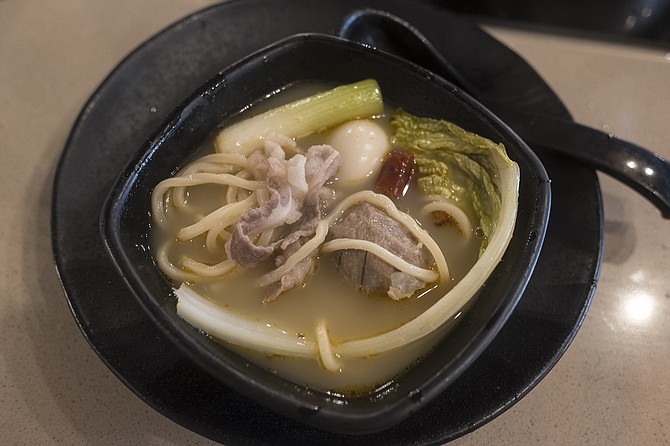 Freshly cooked meat and vegetables, in aromatic chicken broth.