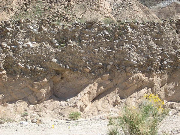 A noticeable change in sedimentary beds called an angular unconformity appears.