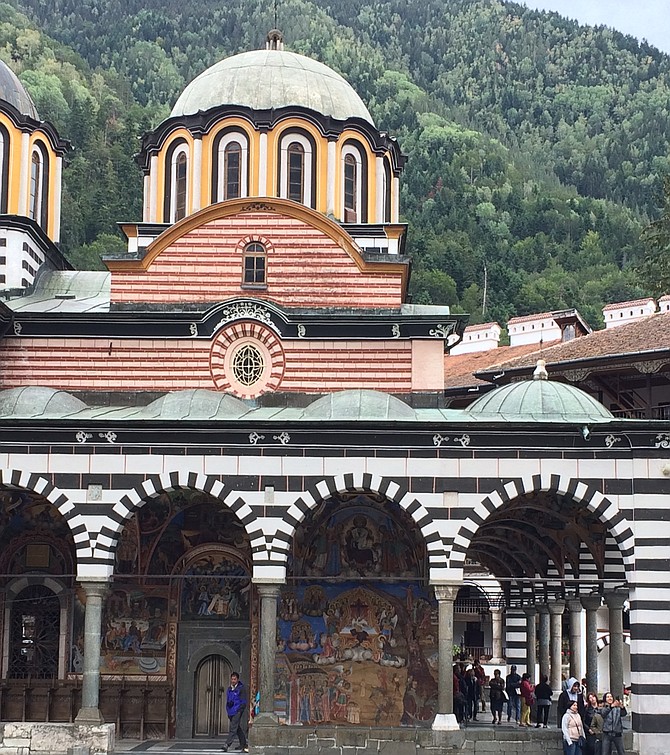 Church of the Nativity at Rila Monastery with mountains looming in the background