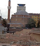 Modern buildings and old mosque above ancient Roman ruins at the Serdika Metro station.