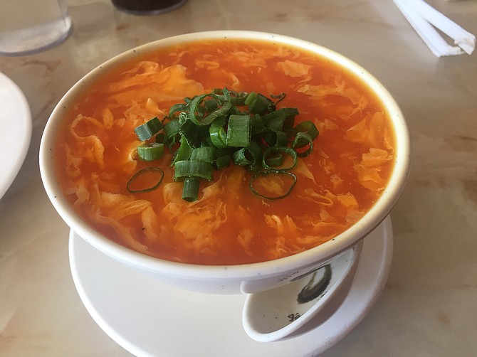 Egg Flower soup topped with chives