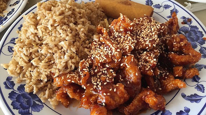 The sesame chicken was sliced thin, lightly breaded, fried, and slathered in a tangy sauce.