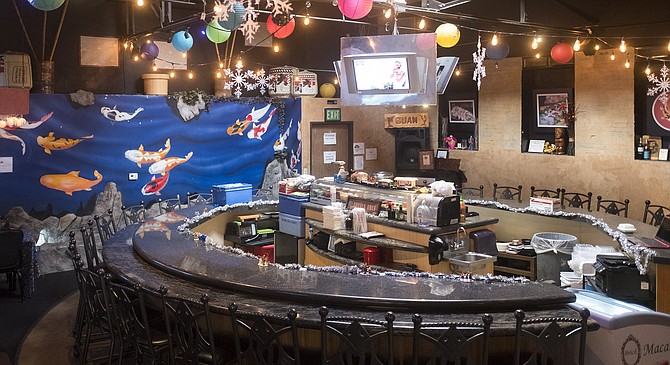 A subterranean sushi bar inside an islander restaurant