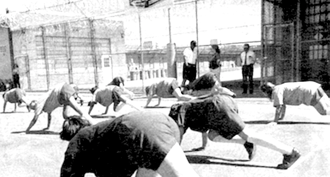 Girls in custody exercising. 91 percent of parolees are re-arrested within three years.