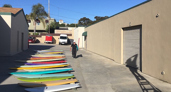 Skip Frye with some of boards he has made