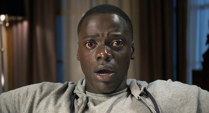 Get Out: No, he’s not reading Internet comments. But the facial expression is right for it.