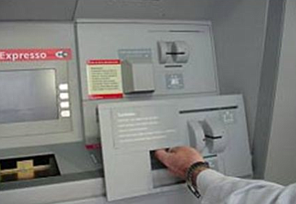 The scammers' skimmers fit right over the bank's card reader.