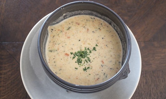 A warming bowl of thick, creamy clam chowder.