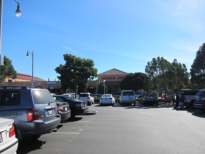 Trader Joe's parking, nearest the church, was full. Beggars parked in the lot. 