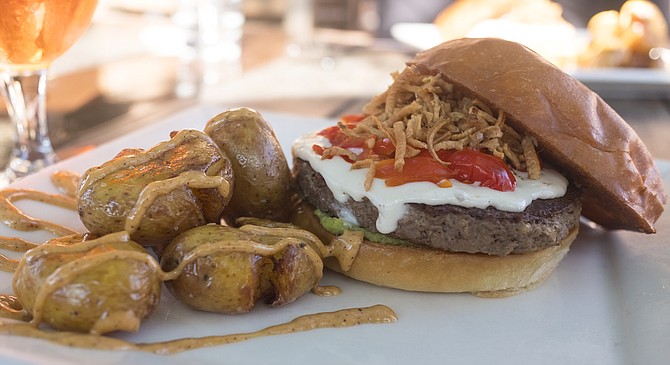 Stone World Bistro's plating of the plant-based Impossible Burger