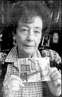 Fanny Lebovits with photo of Liepaja ghetto.