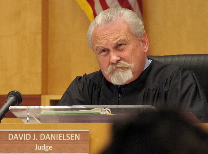 Judge David Danielsen, listening to attorneys