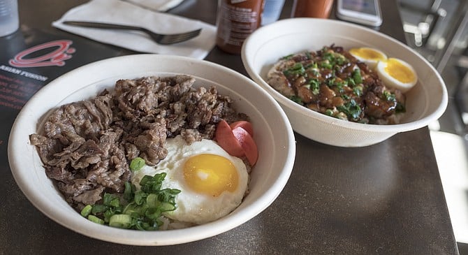 Tapsilog beef and adobo pork belly, each with soft-yolk eggs