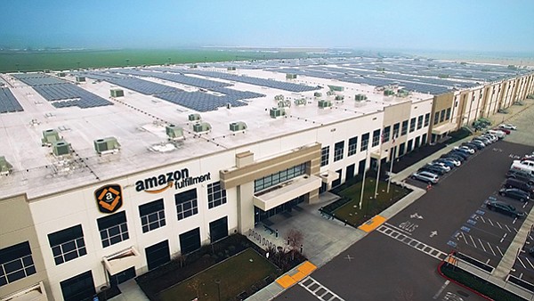 Solar equipment on the roof of an Amazon fulfillment center
