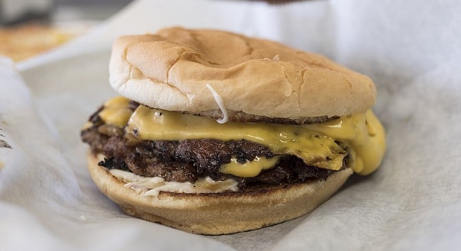 The dirty flat top burger, with plenty of melted cheese.