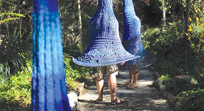 Michelle Montjoy’s giant, indigo, bellflower-like shapes on display at Ship in the Woods.