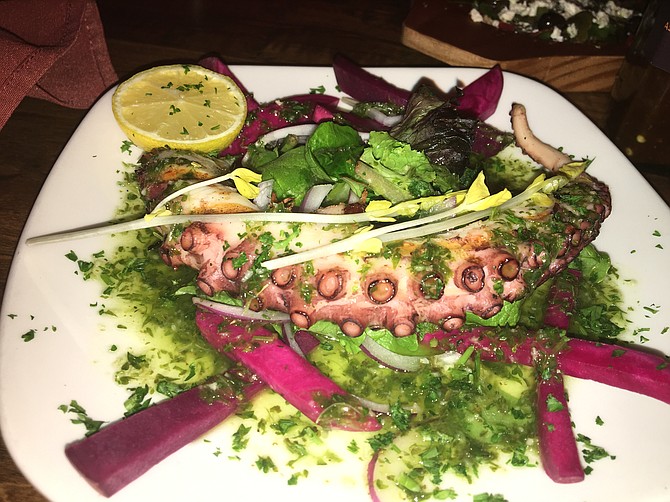 The octopus is chargrilled and served with a salad with a lemony dressing.