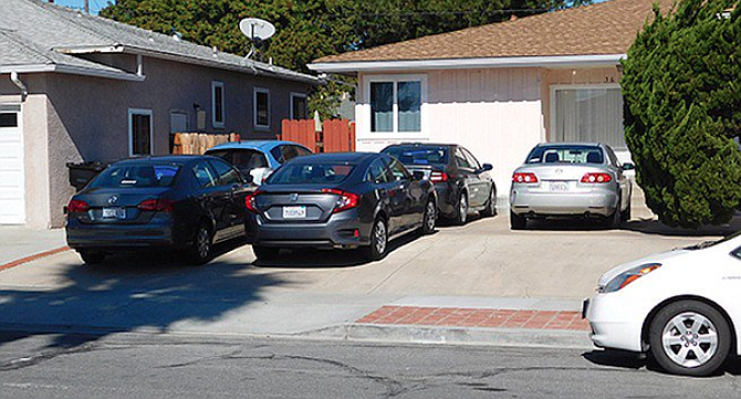 The city is going to stop enforcing parking-on-the-front-yard ordinance.