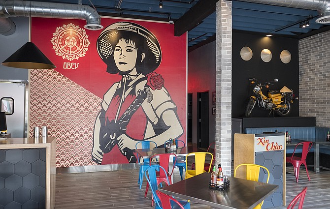 Scooters, conical hats, and a Shepard Fairey print contribute to Shank & Bone's ready for North Park vibe.