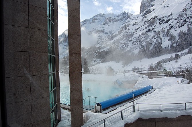 The outdoor pool at the Walliser Alpentherme & Spa complex where one can bathe amidst the winter splendor.