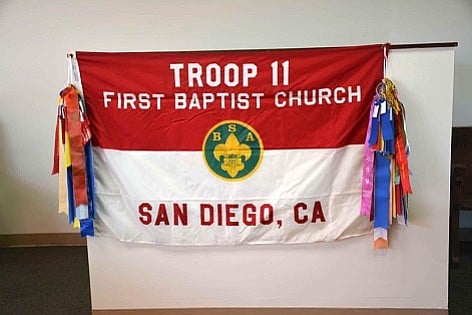 The troop flag was spared as it was stored inside the church.