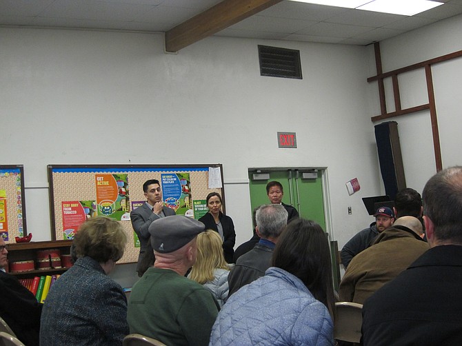 Rebecca Louie (Wakeland) and Jonathan Castillo (PATH) at the February planning  meeting field questions from the community.